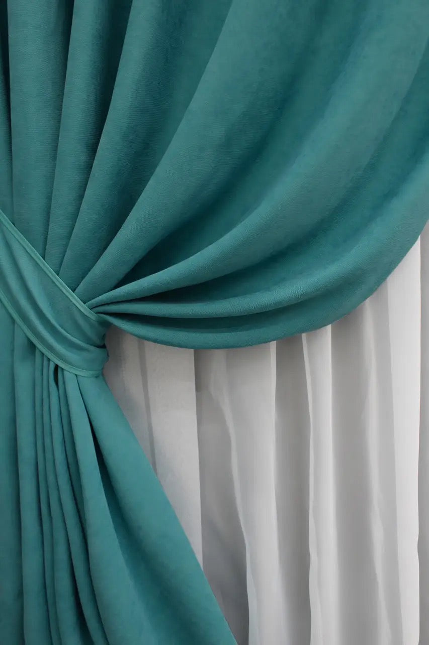 High-quality sea green drapes, creating a cosy yet refined atmosphere in any space.
