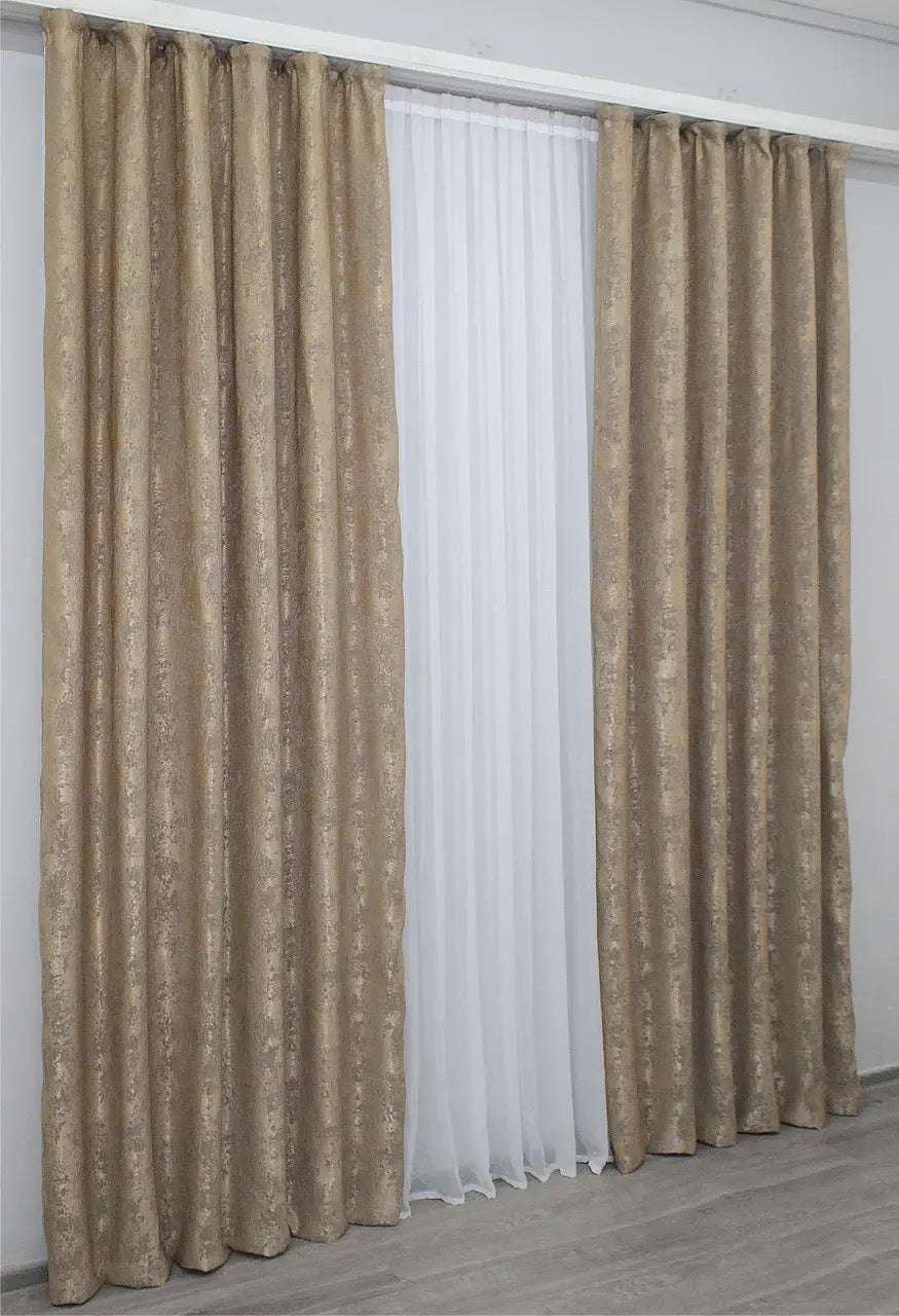 Subtle soft cappuccino jacquard curtains with a textured woven pattern, filtering natural light while maintaining privacy.
