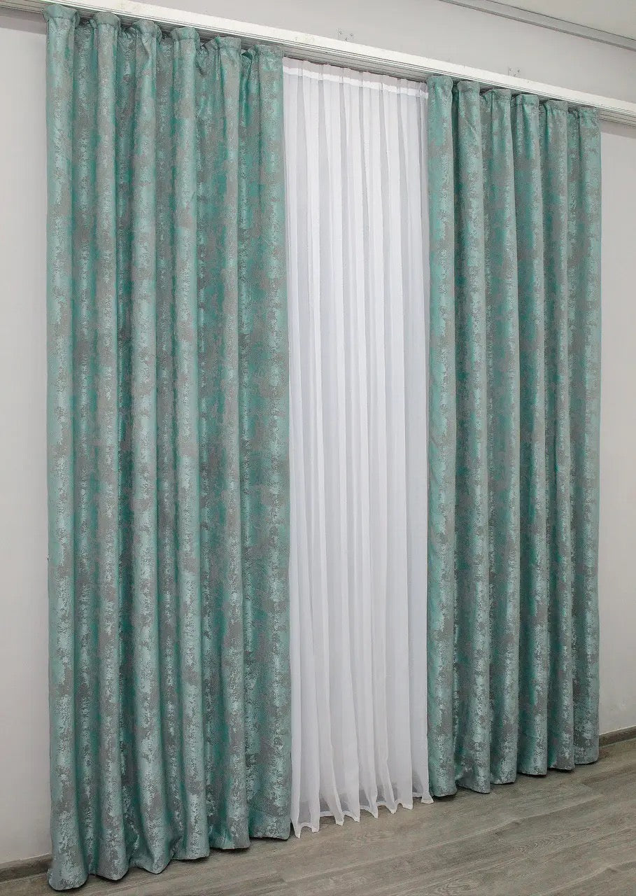 Set of two aqua ash jacquard curtain panels with tie-backs, offering a polished and elegant window treatment.
