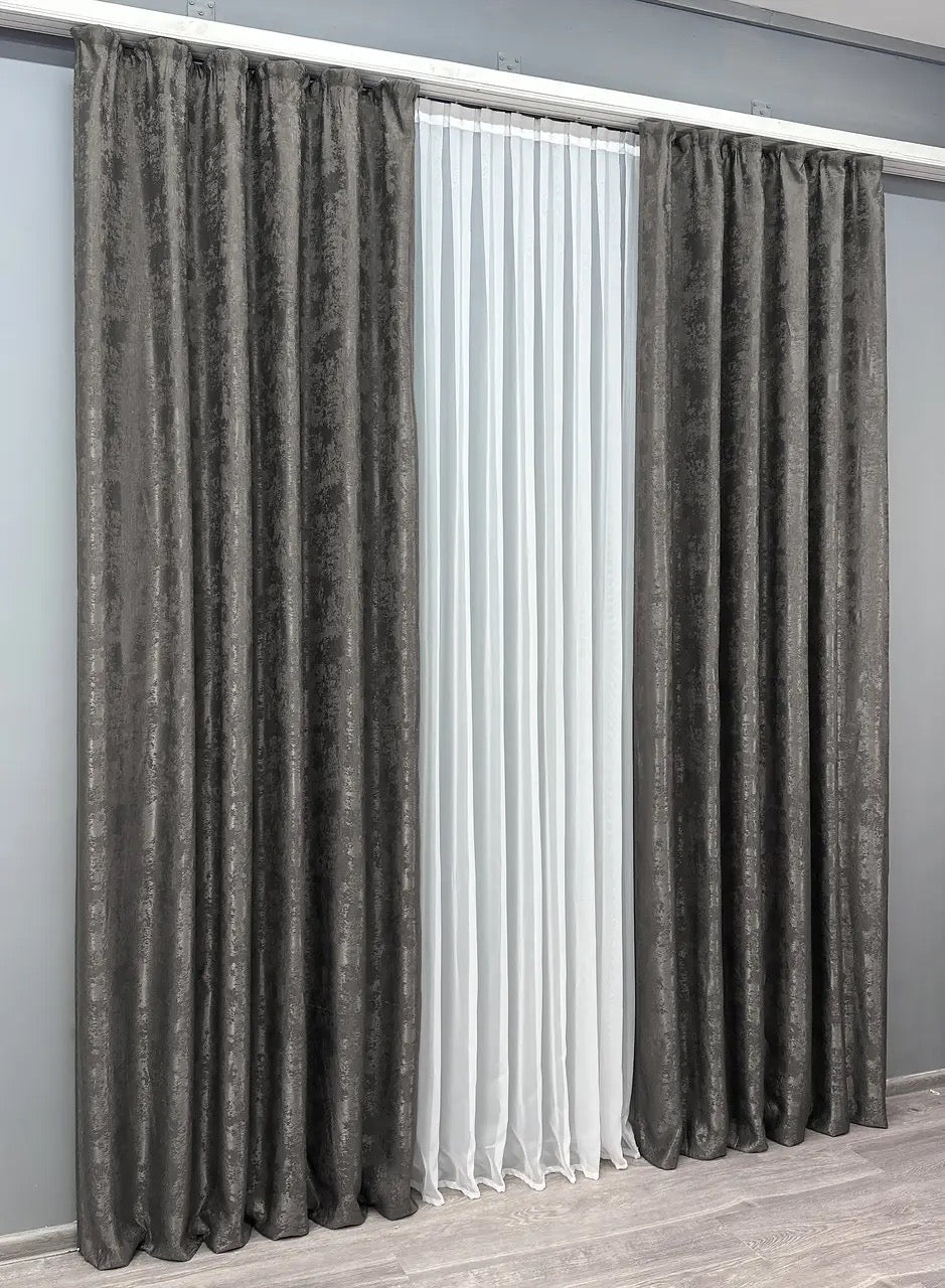 Set of two dark grey jacquard curtain panels with matching tie-backs, providing a polished and elegant window treatment.
