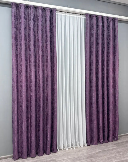 Set of two deep amethyst jacquard curtain panels with matching tie-backs, providing a polished and elegant window treatment.
