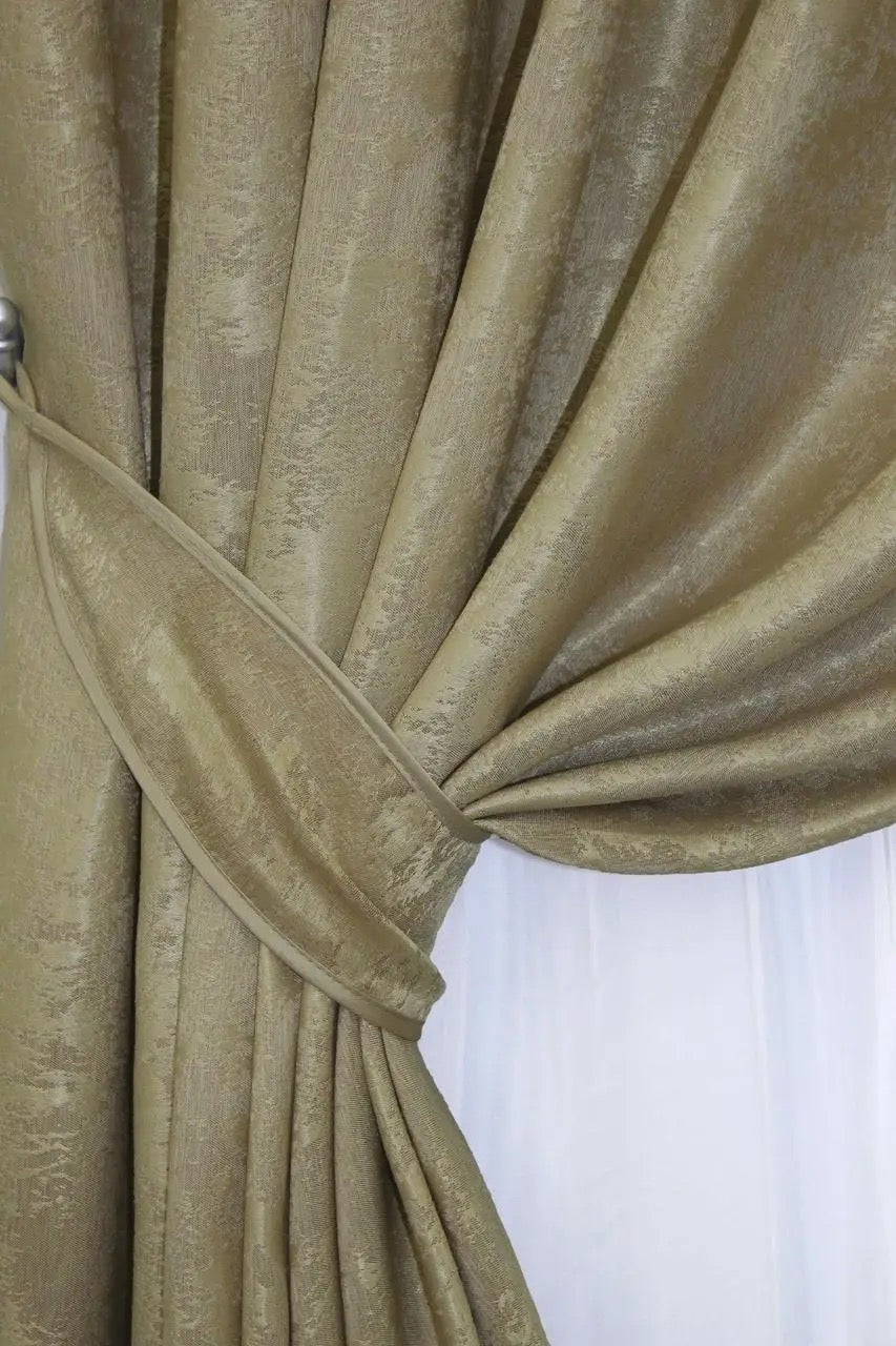 Set of two golden jacquard curtain panels with matching tie-backs, offering a polished and elegant window treatment.
