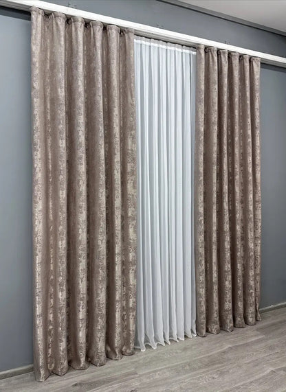 Set of two mink brown jacquard curtain panels with tie-backs, offering a polished and refined window treatment.
