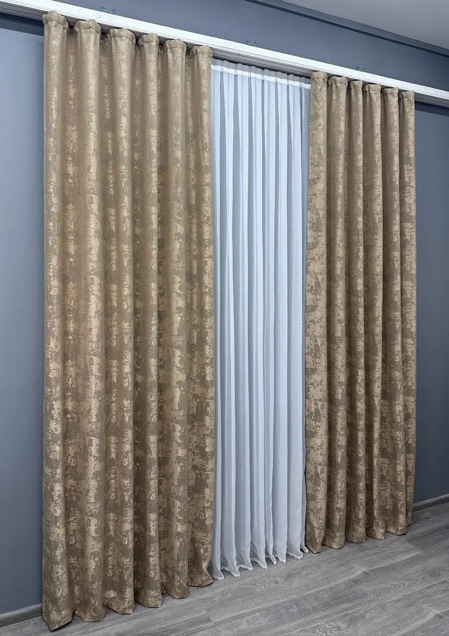 Set of two caramel jacquard curtain panels with matching tie-backs, offering a polished and elegant window treatment.
