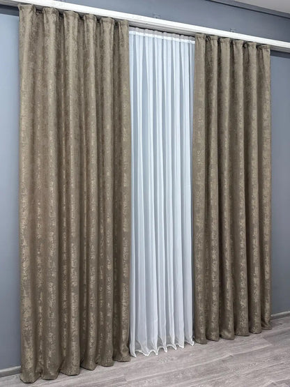 Set of 2 cocoa brown jacquard curtain panels, designed to create a cozy and inviting atmosphere while maintaining privacy.
