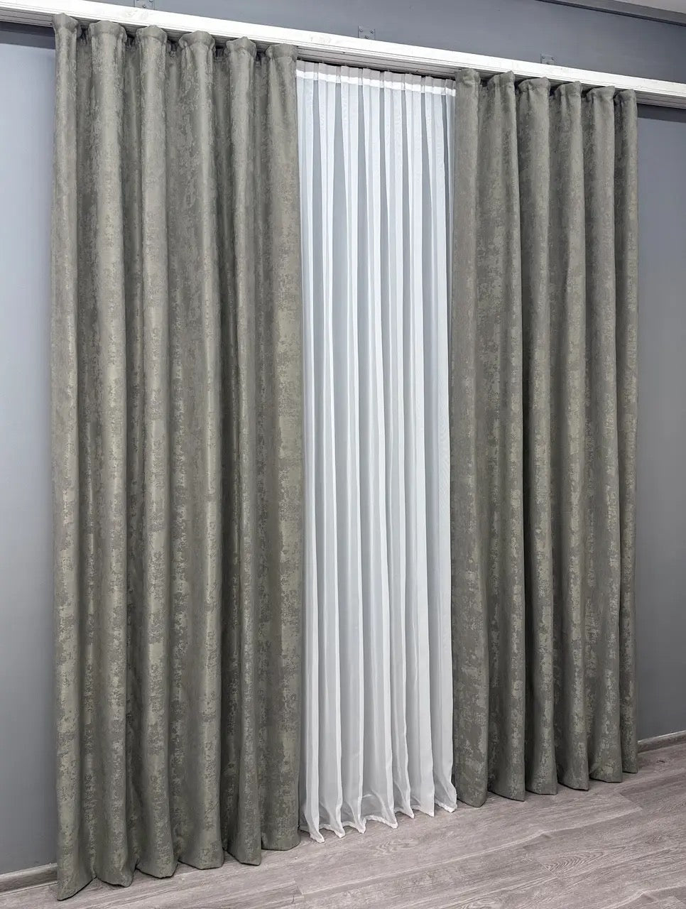 Set of 2 graphite grey jacquard curtain panels, designed to create a sleek, contemporary look while maintaining privacy.