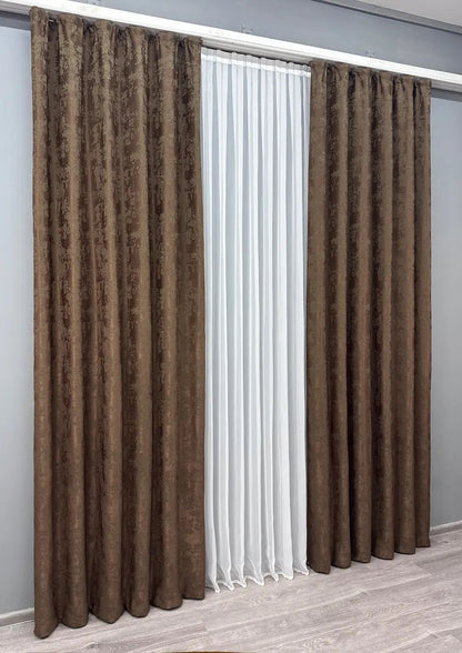 Set of 2 light brown jacquard curtain panels, designed to create a warm and inviting atmosphere while maintaining privacy.
