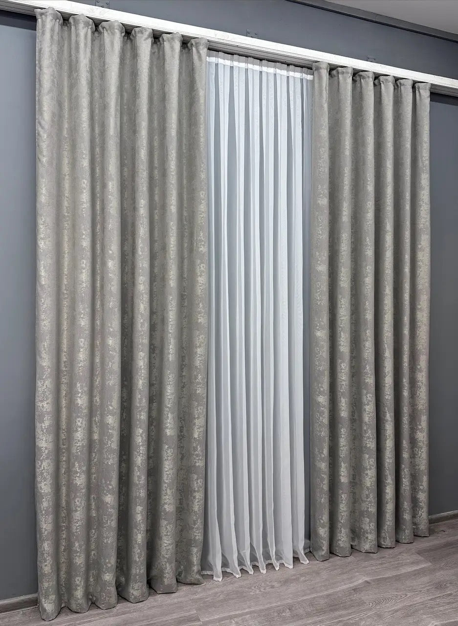 Set of 2 light grey jacquard curtain panels, designed to create a tranquil and stylish ambiance while maintaining privacy.
