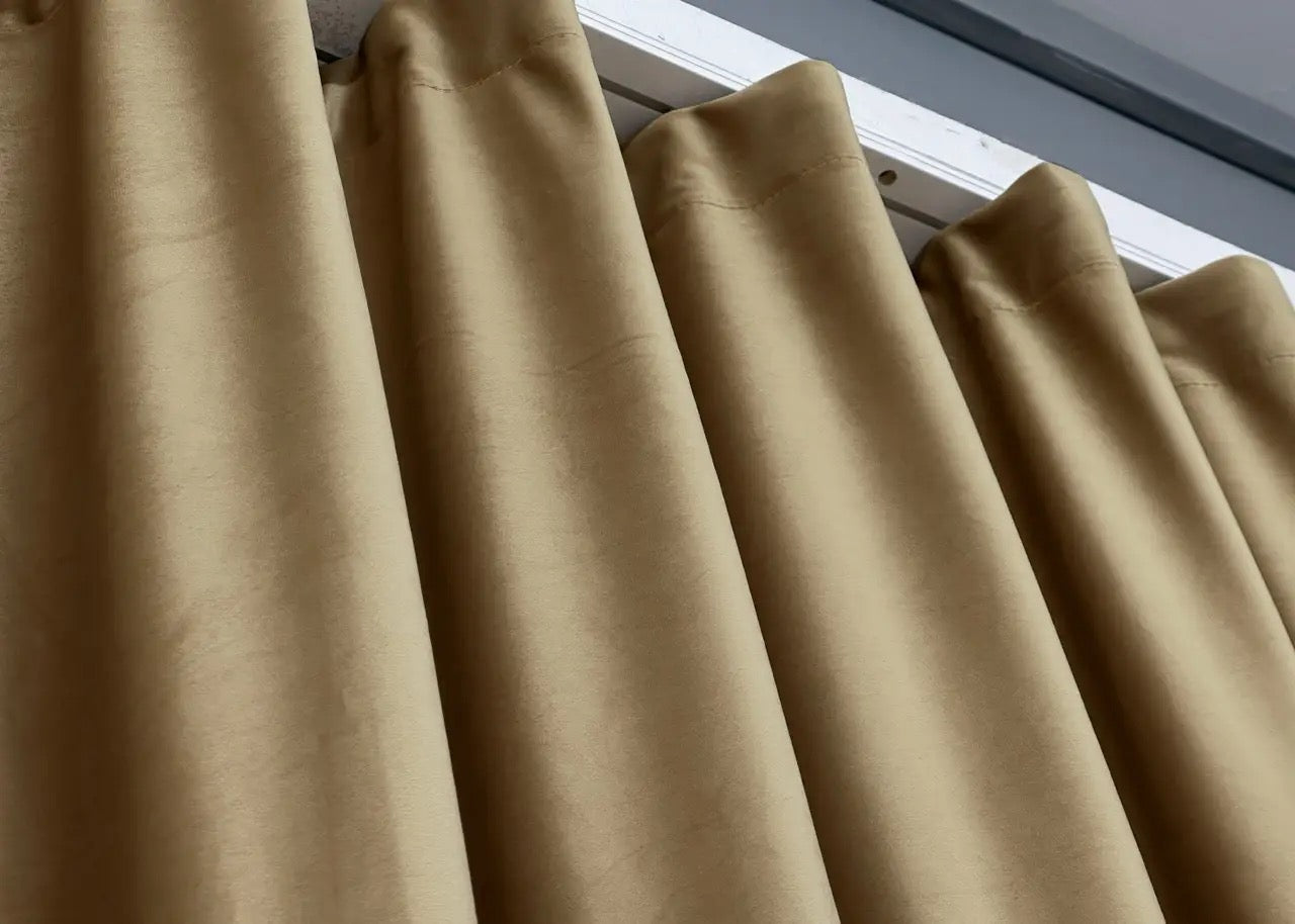 Light coffee-coloured velvet curtain panels, featuring noise-absorbing material and a luxurious soft feel.