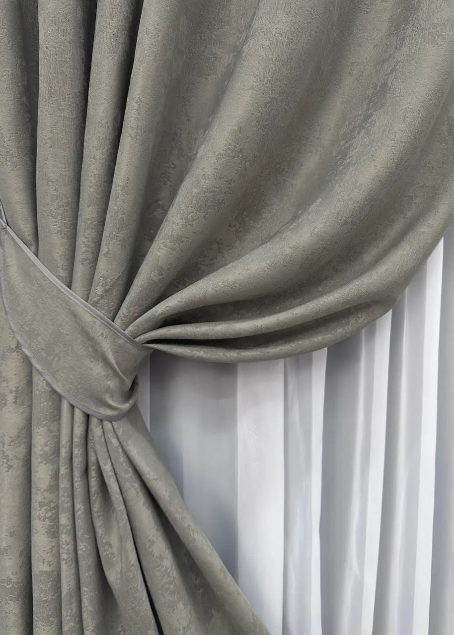 High-quality jacquard curtains in graphite grey, blocking 70% of light while enhancing the atmosphere of any space.
