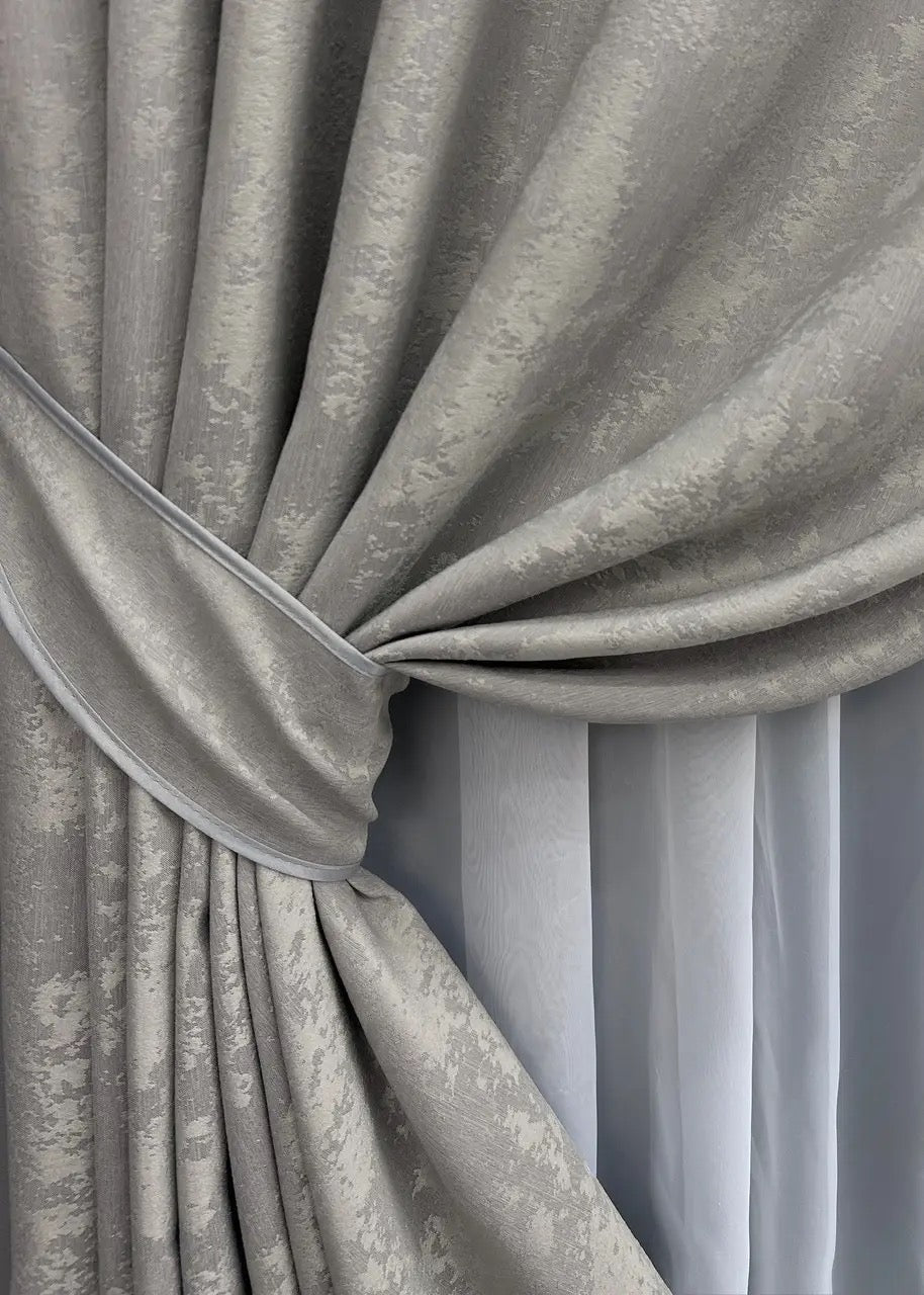 High-quality jacquard curtains in light grey, blocking 70% of light while enhancing the atmosphere of any space.
