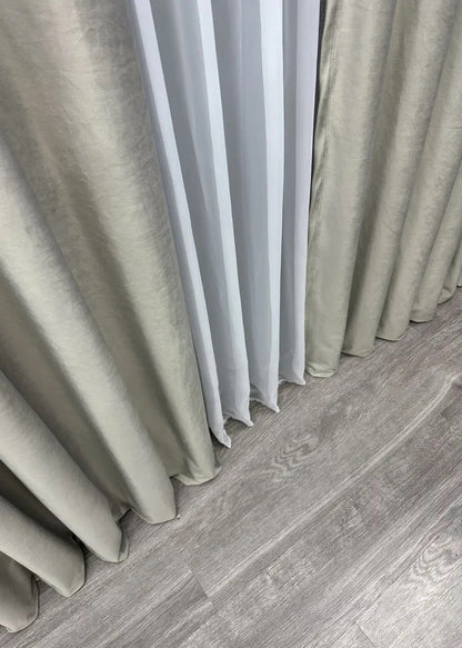 Soft-touch satin velvet curtains in a delicate shade, designed for contemporary and luxurious window treatments in any space.
