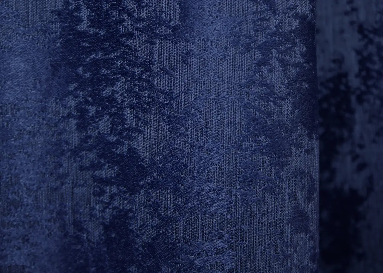 Luxurious blue curtains with an intricate jacquard weave, adding depth and richness to your interior.
