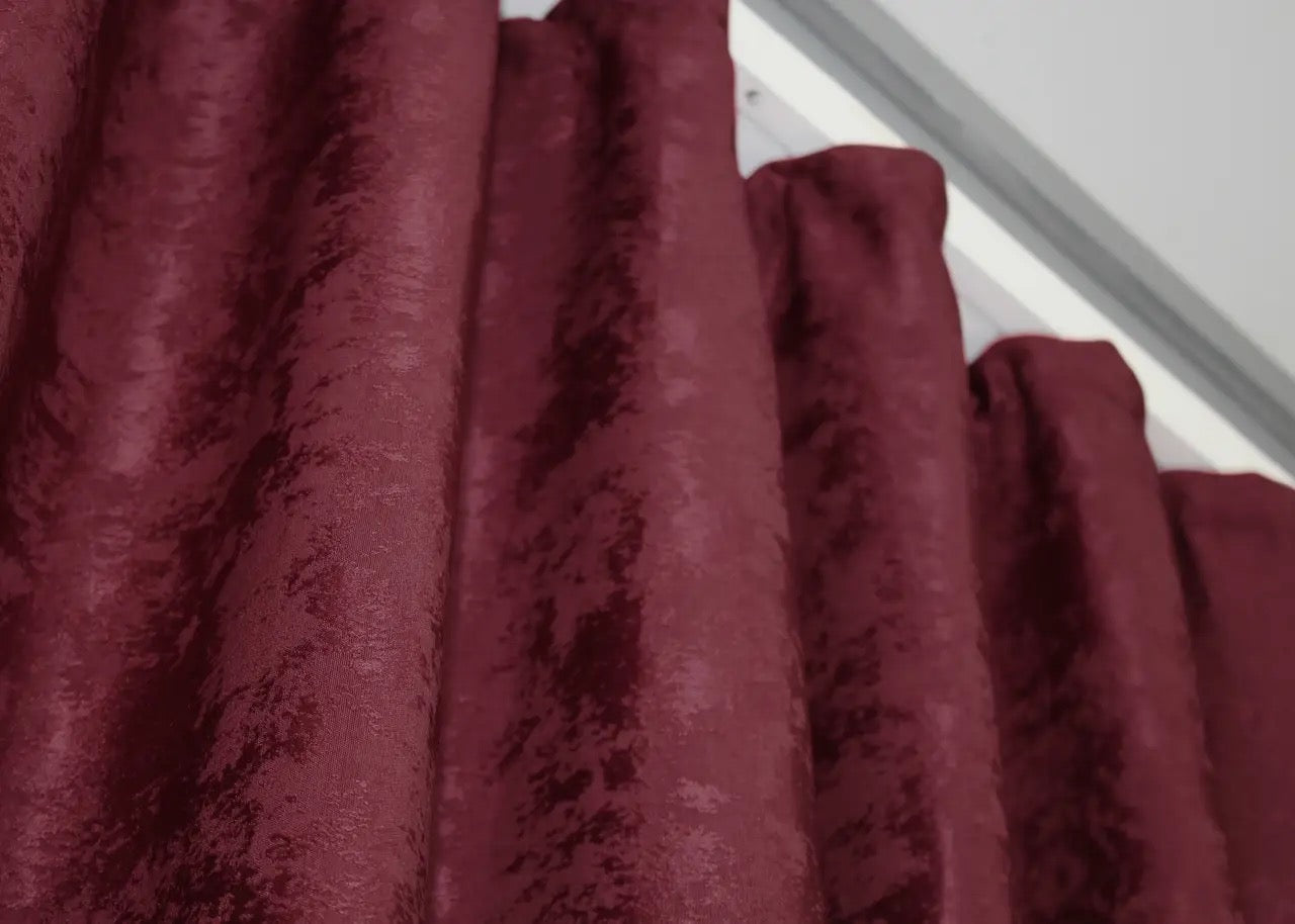 Luxurious burgundy curtains with an intricate jacquard weave, adding depth, elegance, and warmth to any space.
