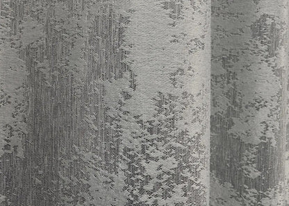 Luxurious ice silver curtains with a soft shimmer, providing depth and sophistication to any home setting.
