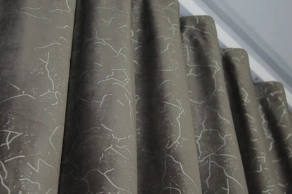 Soft, luxurious dark brown velvet curtains with light-blocking capabilities, ideal for enhancing privacy in bedrooms and living rooms.
