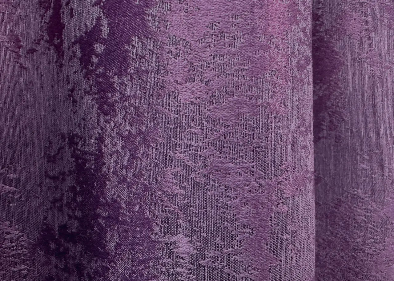 Regal deep amethyst curtains with an intricate jacquard weave, adding depth, elegance, and warmth to any space.
