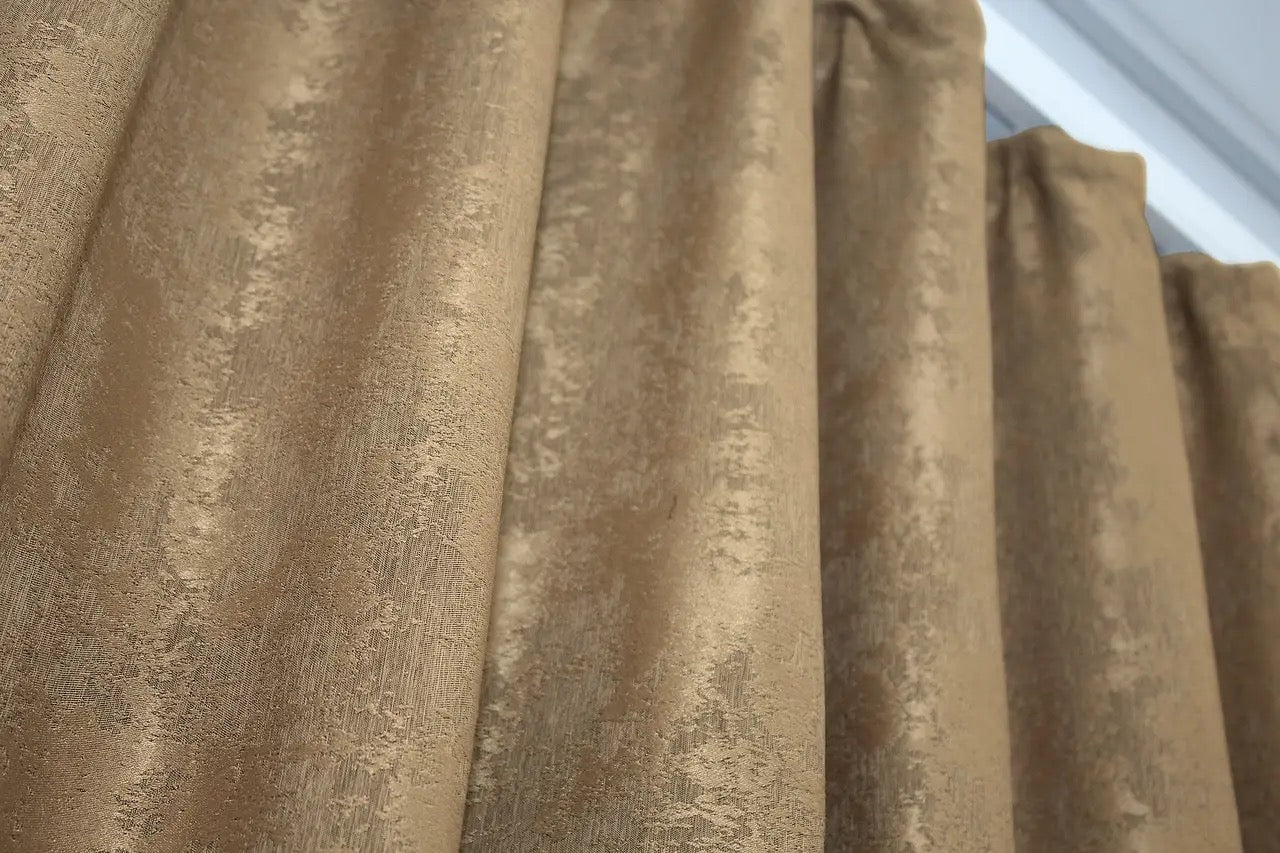 Semi-blackout honey-golden jacquard curtains that filter natural light while enhancing the aesthetics of any room.
