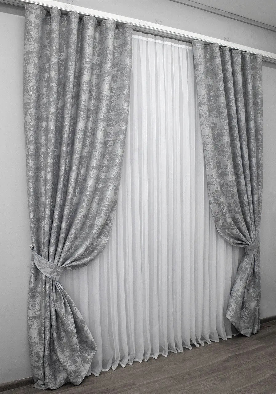 Stylish ice grey curtains with a subtle shimmer, seamlessly blending into elegant living spaces.
