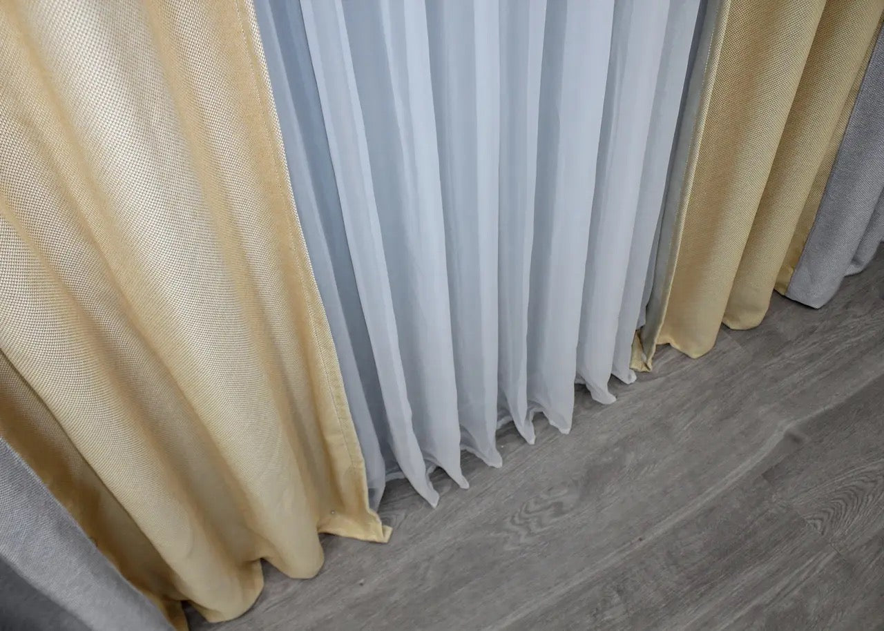 Soft light grey and beige linen blackout curtains offering a sophisticated balance of privacy, light filtration, and comfort.
