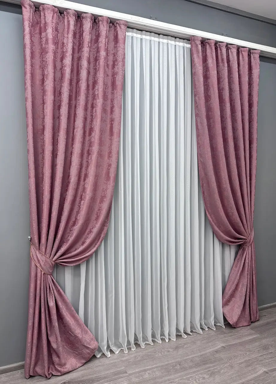 Stylish dusky pink curtains designed with a subtle, muted tone, ideal for both modern and classic interiors.
