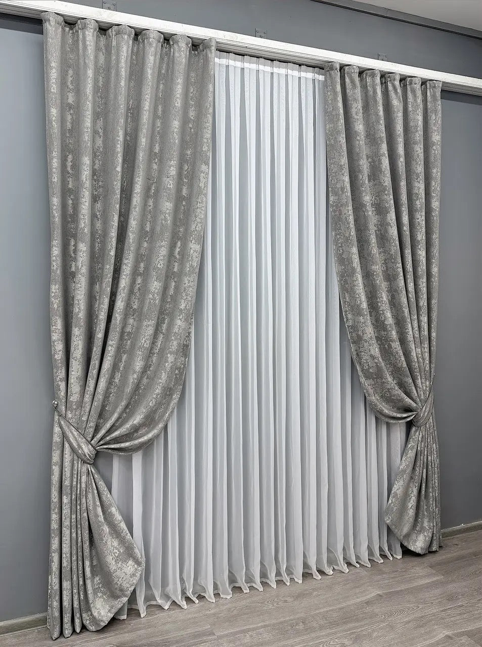 Luxury platinum grey jacquard curtains featuring a soft metallic finish, perfect for modern and classic interiors.
