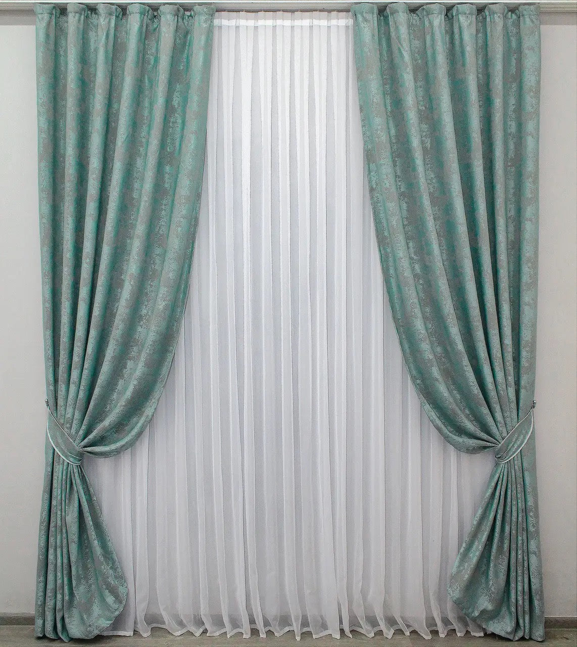 Luxury muted teal jacquard curtains with a delicate sheen, perfect for modern and classic interiors.
