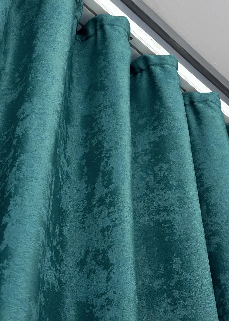 Luxurious dark cyan curtains with an intricate jacquard weave, adding depth, elegance, and richness to any space.
