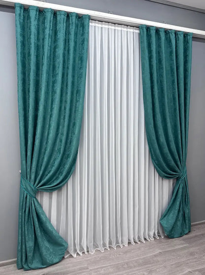 Stylish deep aqua curtains designed with a vibrant, ocean-inspired tone, ideal for both contemporary and classic interiors.
