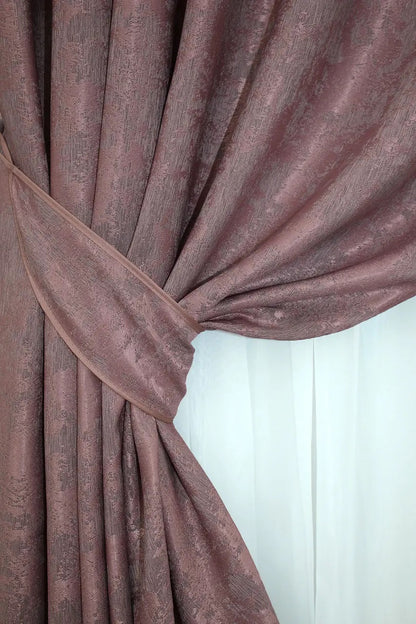 Non-blackout raspberry grey jacquard curtains that provide privacy while letting soft natural light filter through.
