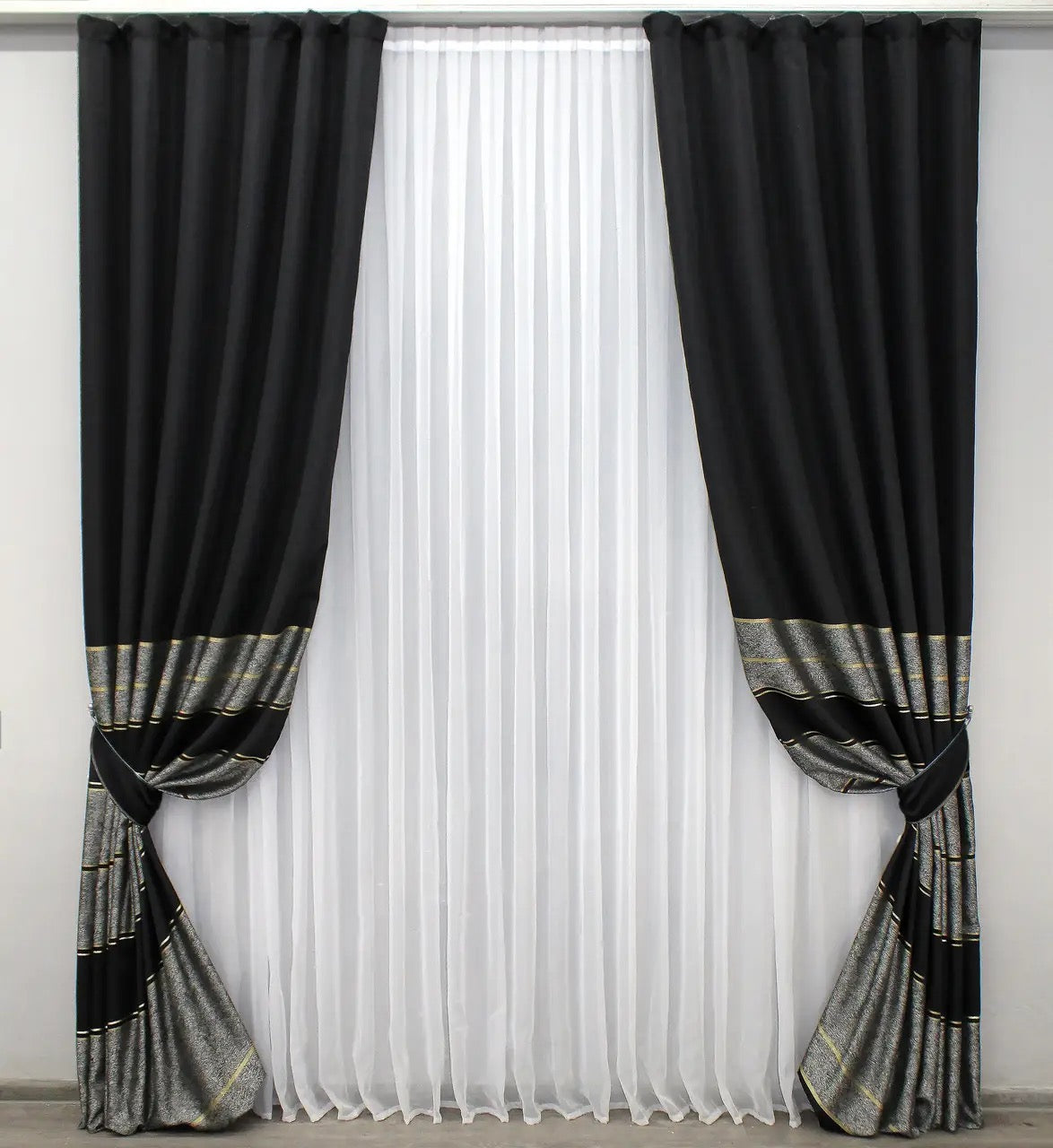 Luxury black-grey and gold linen drapes with a subtle striped pattern for contemporary interiors.
