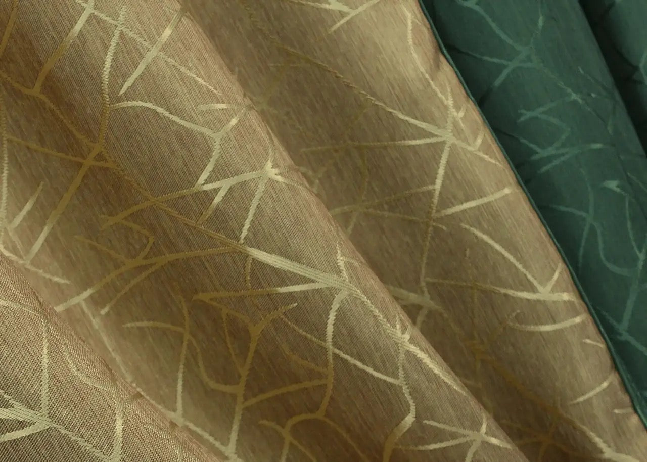 Luxury dark green and gold combined jacquard curtains with a rich textured finish, ideal for adding depth and elegance to any space.
