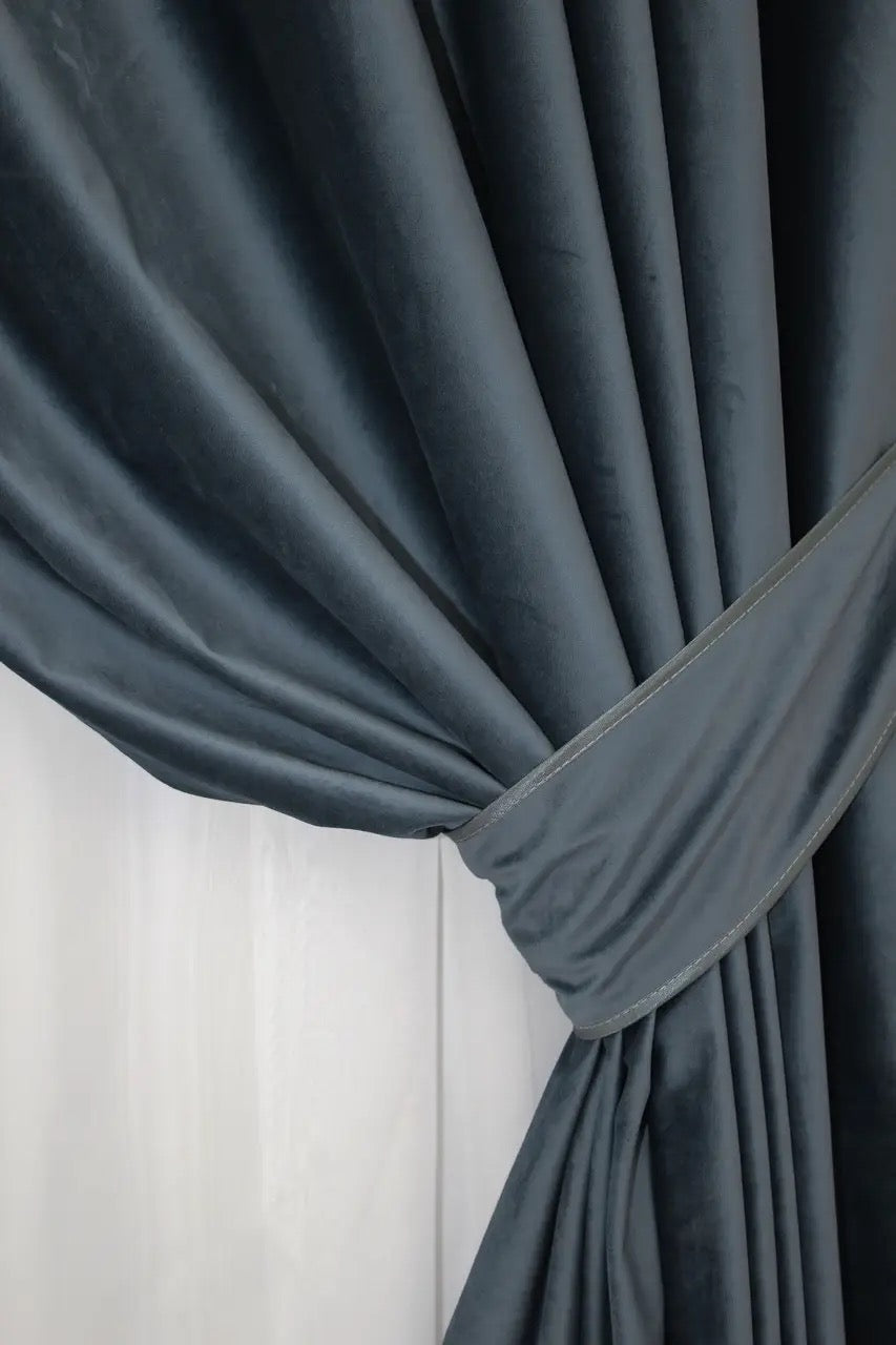 Modern dark grey-blue velvet curtains with premium light-blocking features, ideal for contemporary home interiors.
