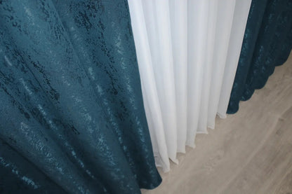 Contemporary deep blue linen drapes, designed to complement minimalist, modern, and refined home décor.
