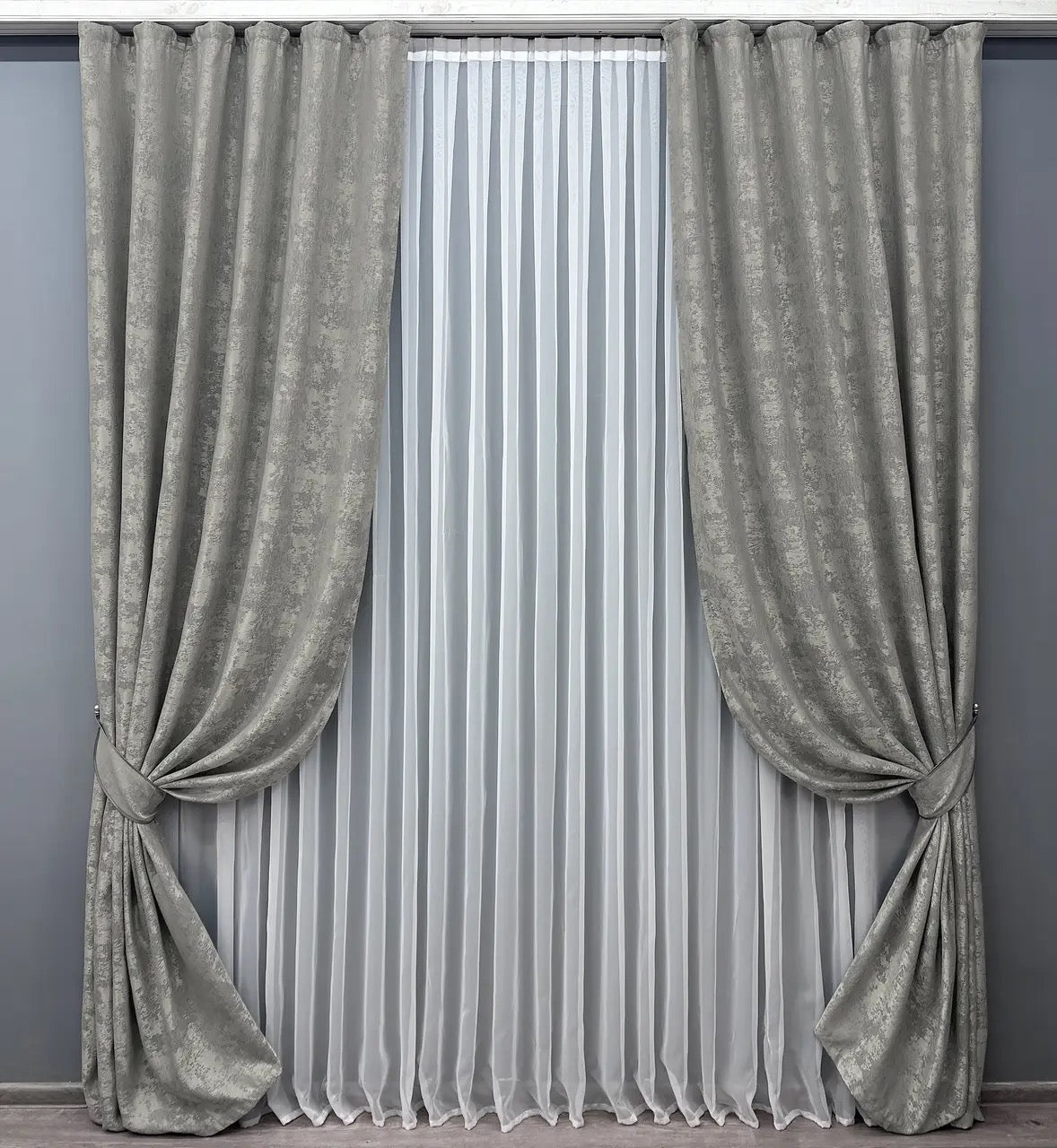 Luxury silver jacquard curtains with intricate woven patterns, adding sophistication and brightness to any interior.
