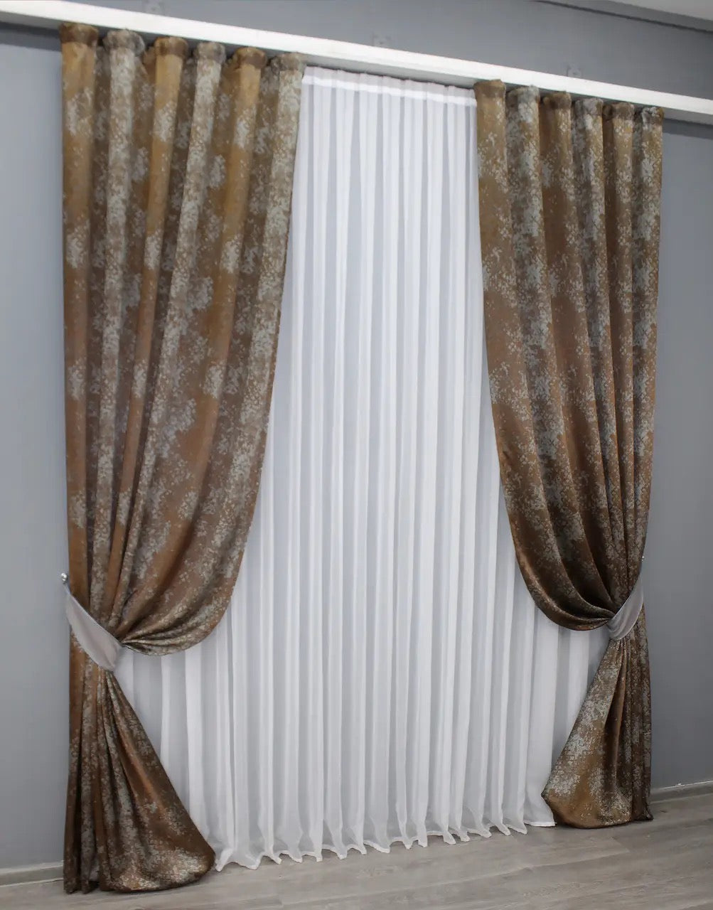 High-quality light-filtering linen curtains in a warm copper and soft grey blend, ideal for contemporary homes.
