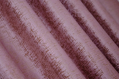 Timeless pink and gold velvet drapes with 90% light-blocking capability, creating a serene and luxurious environment.
