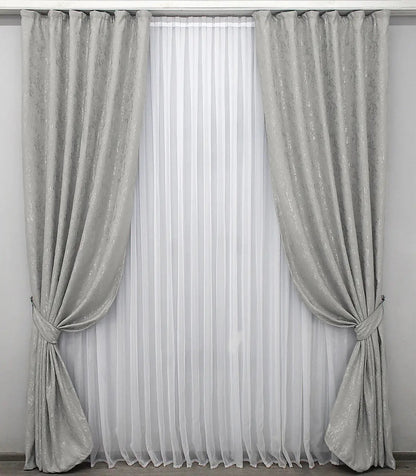 Elegant silver linen drapes with a soft marble texture, perfect for minimalist and contemporary spaces.
