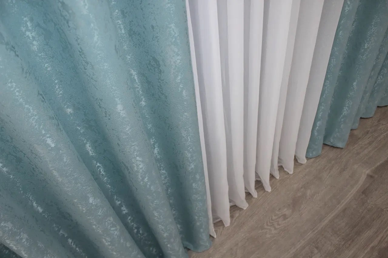 Lightweight sky blue linen drapes with an airy and soft feel, perfect for creating a serene ambience.
