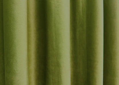 Elegant olive velvet curtains hanging in a sophisticated living room décor.
