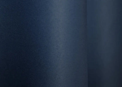 Luxury blue blackout curtains offering warmth and a polished aesthetic.
