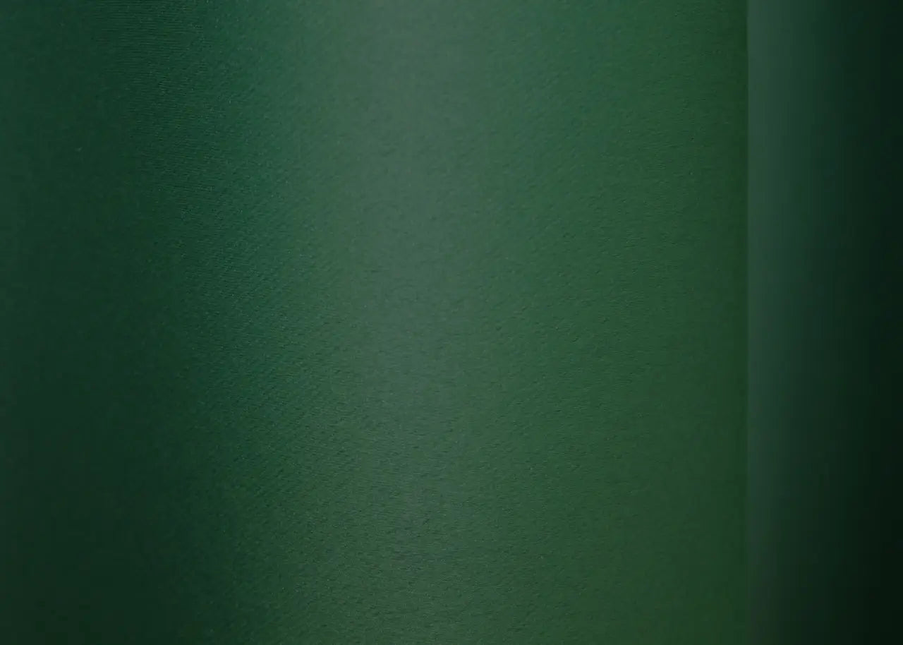 Luxury dark green blackout curtains, perfect for creating a sophisticated space.
