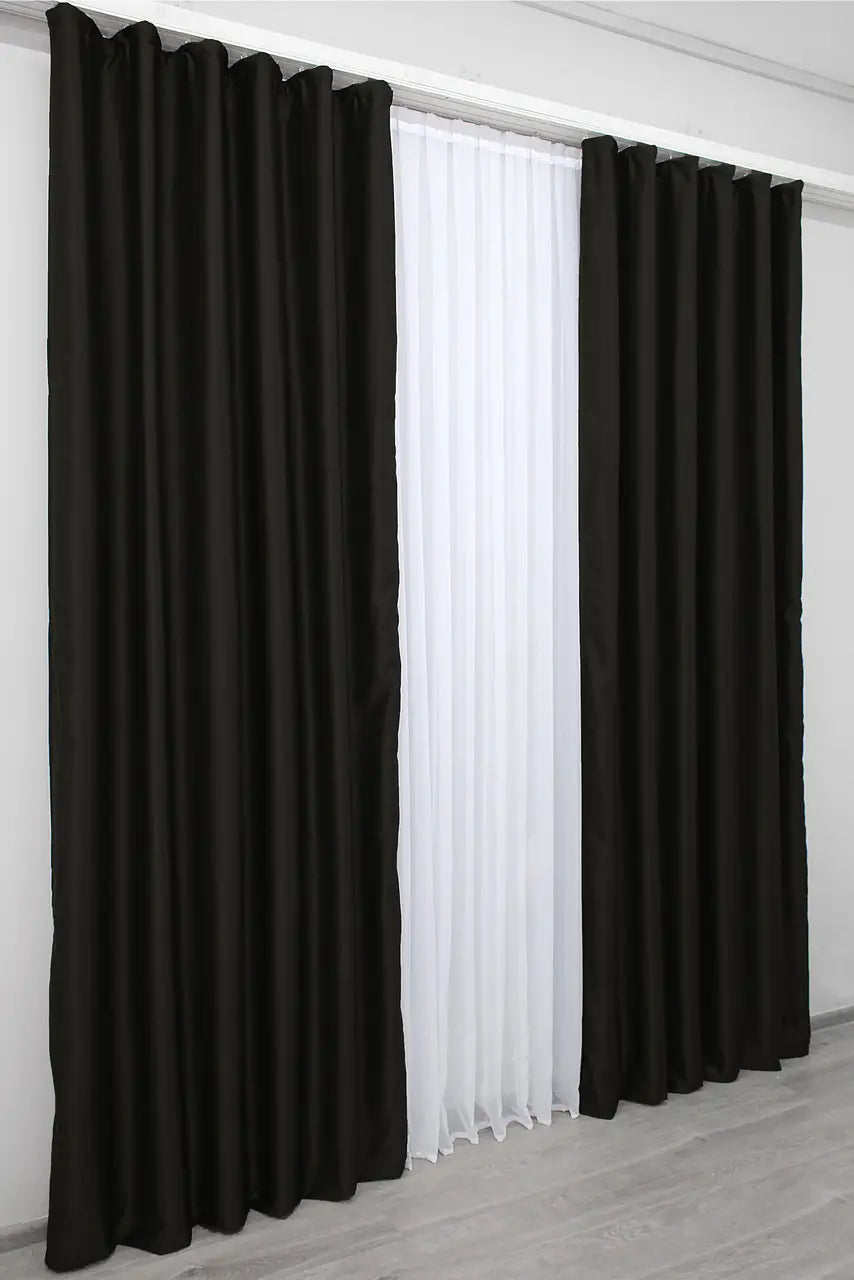 Matte black dimout curtains with superior light reduction properties.
