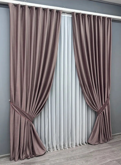 Mauve blackout velvet drapes, designed for elegant home decoration, reducing glare and enhancing privacy in any space.
