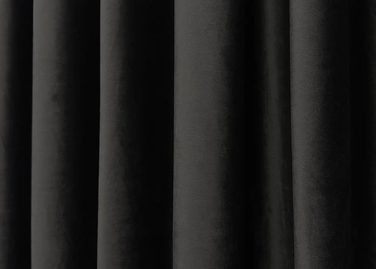 Midnight black velvet blackout drapes, ideal for luxurious and stylish window treatments.
