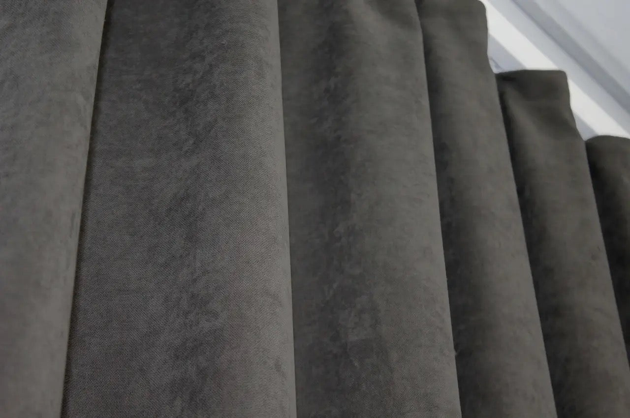 Dark grey curtains with a sophisticated finish, creating a calming and stylish atmosphere.
