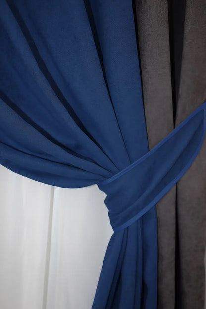 Stylish combined microvelvet curtains in dark cocoa, navy, and blue, adding depth and elegance to contemporary décor.
