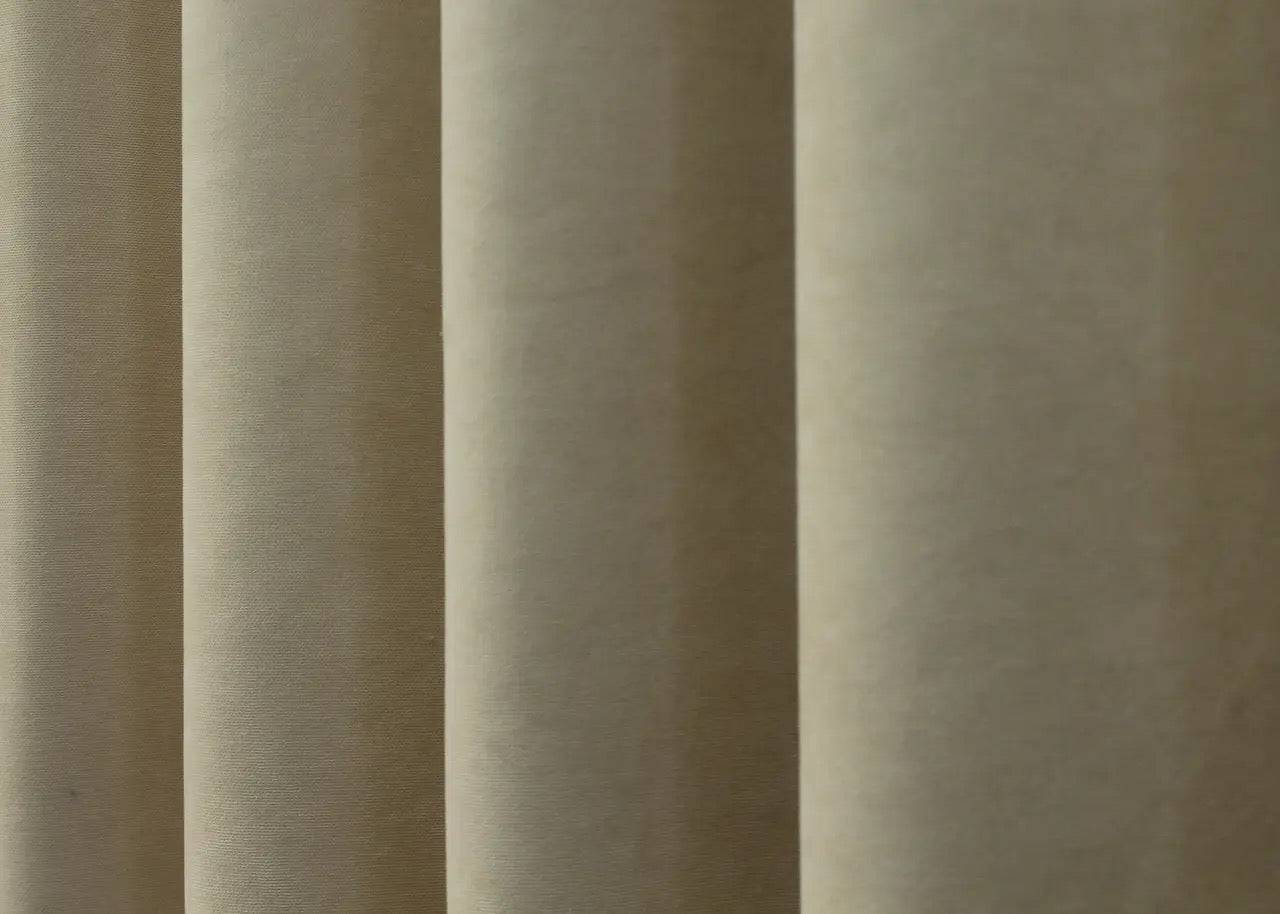 Modern luxury beige curtains with a plush velvet finish, elevating home décor.
