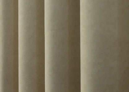 Modern luxury beige curtains with a plush velvet finish, elevating home décor.
