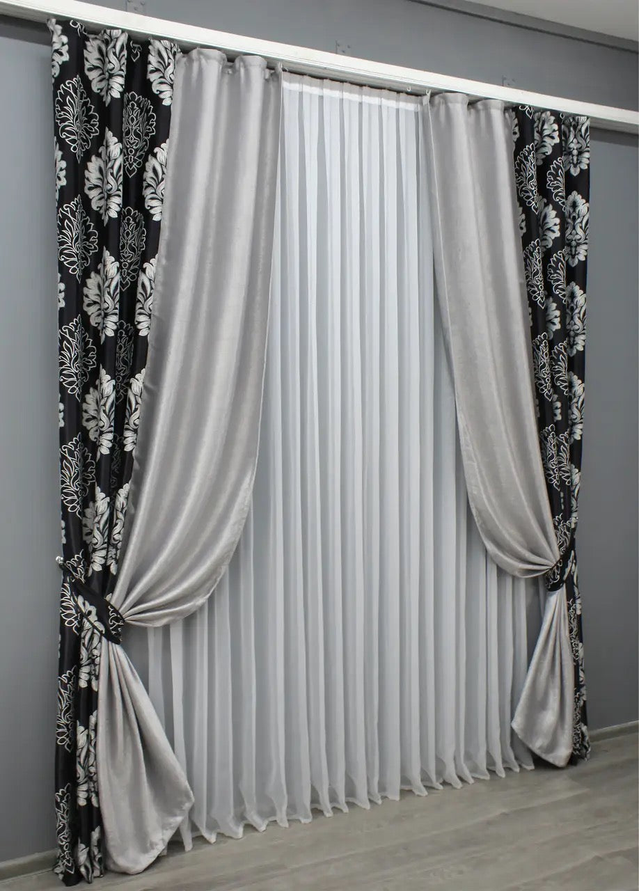 Elegant two-tone black and light grey blackout curtains that provide privacy while complementing contemporary and classic décor.
